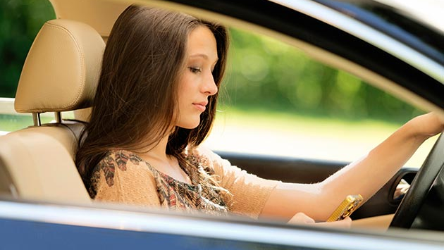 Female texting while driving.