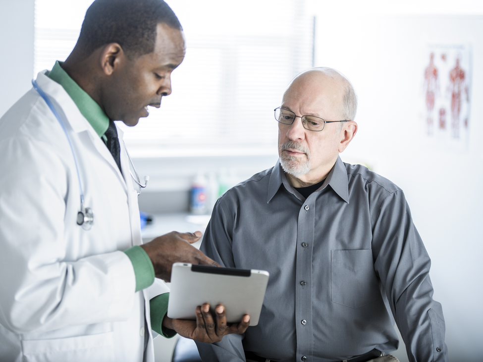 A doctor talks with his patient.