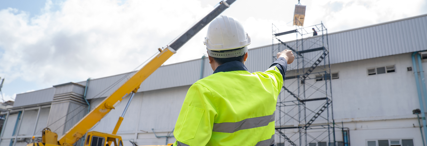 A big mobile crane lifts freight.