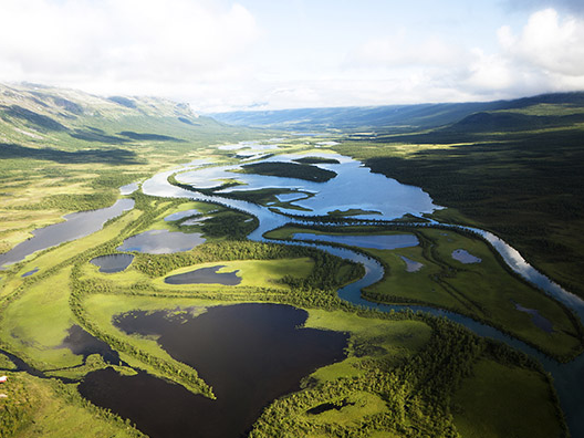 overshot view of valley with green and water