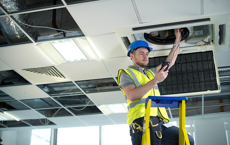 Facility service provider doing work in the ceiling.