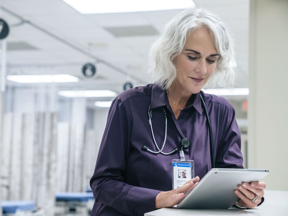 Healthcare practitioner assesses her insurance needs while at her clinic.