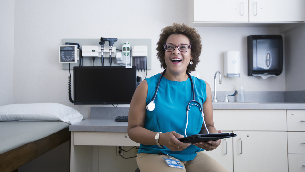 Doctor holding a tablet.