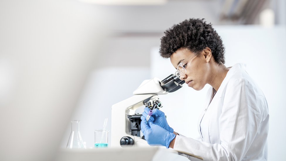 female-scientist-microscope-lab.jpg