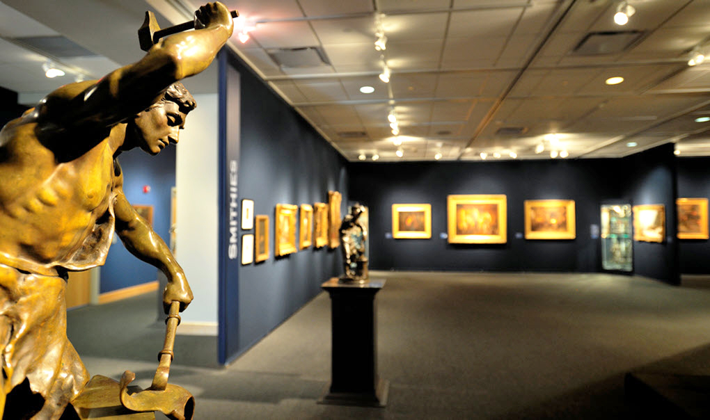 Close up of a gold statue in a museum.