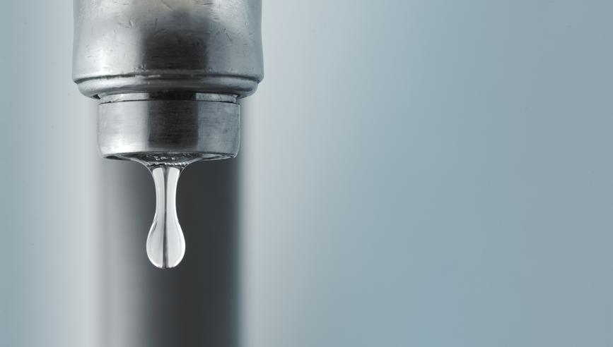 Close-up of a dripping faucet.