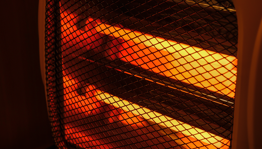 Close-up of glowing heating elements of a electric heater.