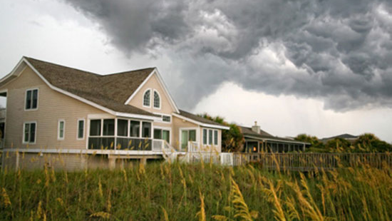 Home with tornado starting to form.