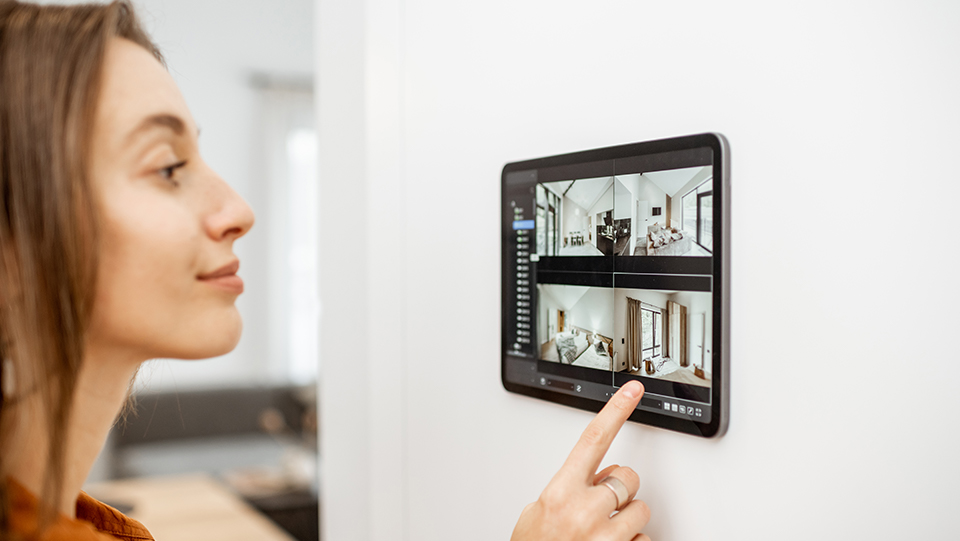 woman protecting her home using home security system