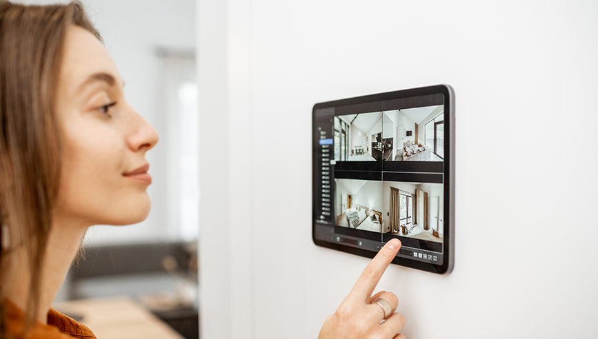 Woman protecting her home from a smart home device.