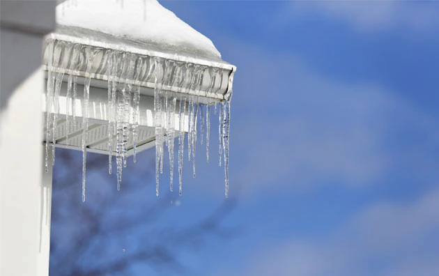 Ice dam on the side of the house.