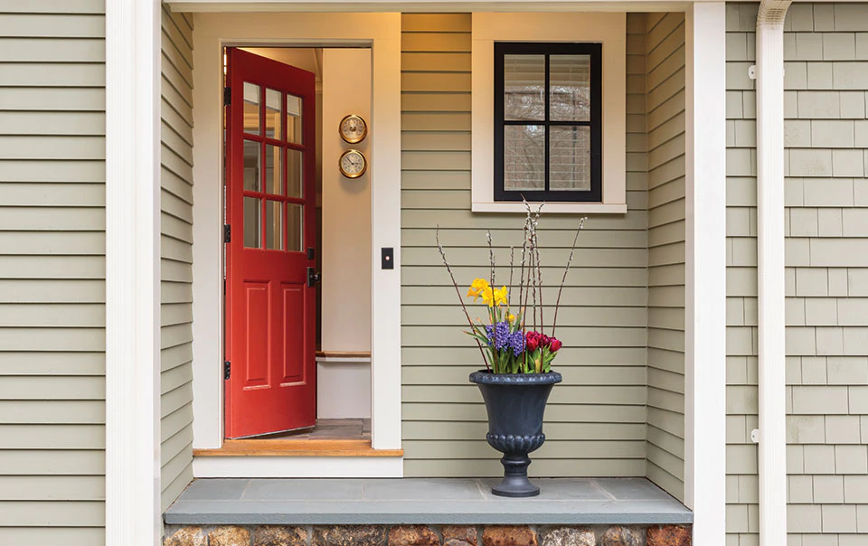 Image of home with the front door ajar. 