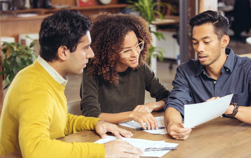 Couple talking with insurance representative