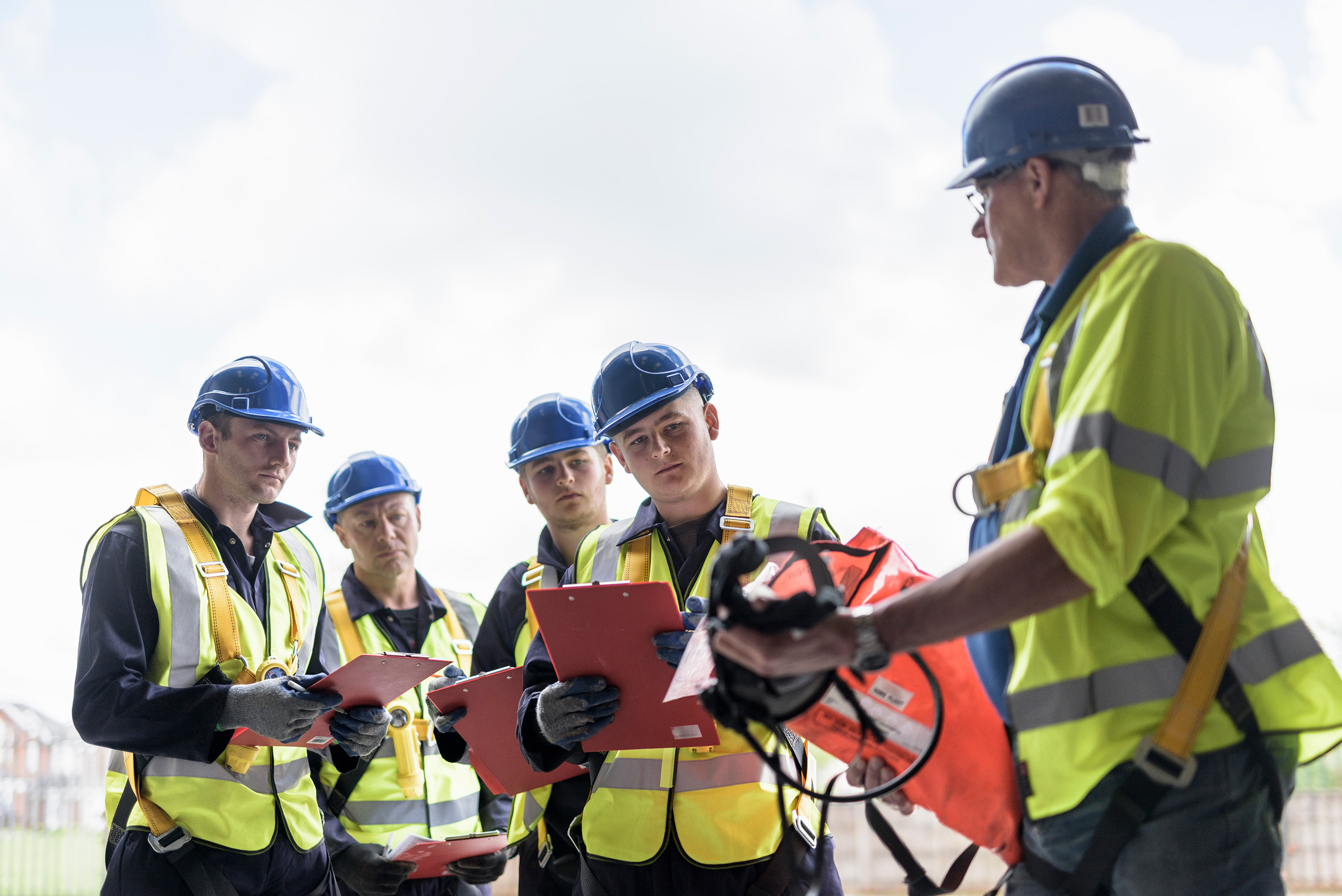 Apprentice builders in presentation in training facility