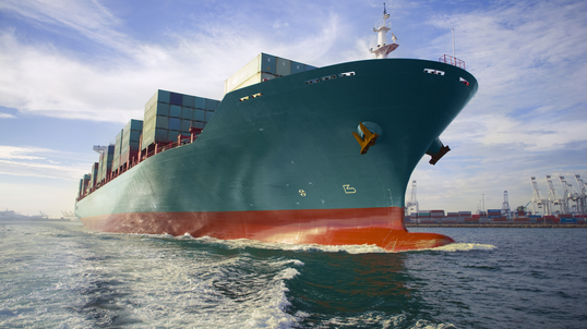 Cargo ship on the water in transit.