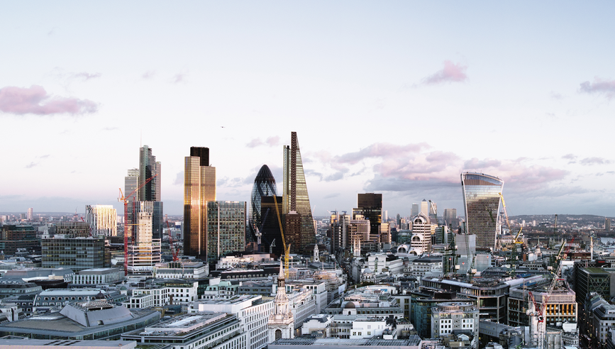 Elevated view over London City skyline at sunset