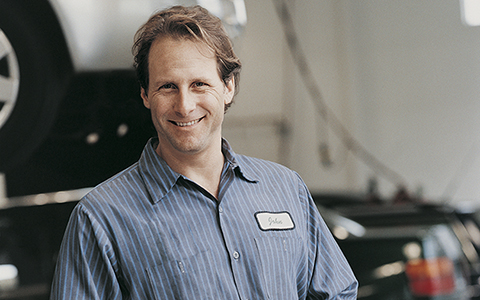 Maintenance man smiling while in uniform