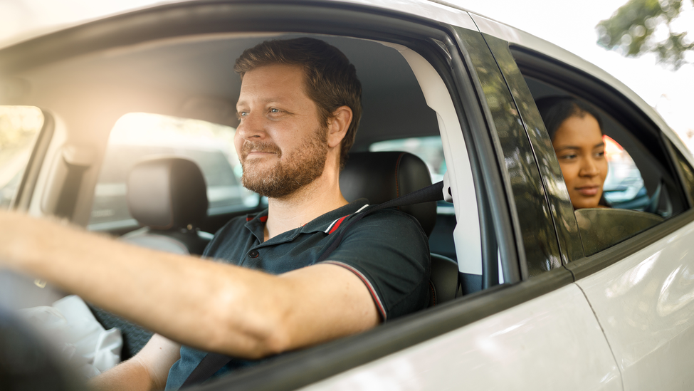 Driver with passenger.