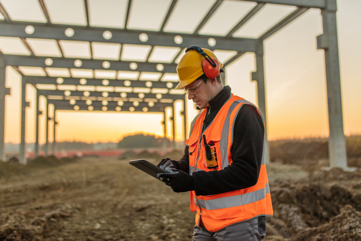 man inspecting construction site