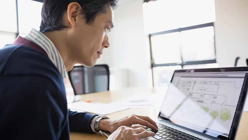 Man on computer protecting intellectual property.