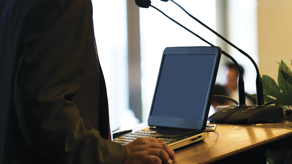 Businessman making a speech at a conference hall