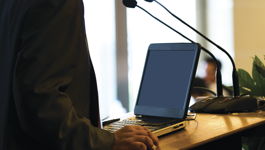 Businessman making a speech at a conference hall