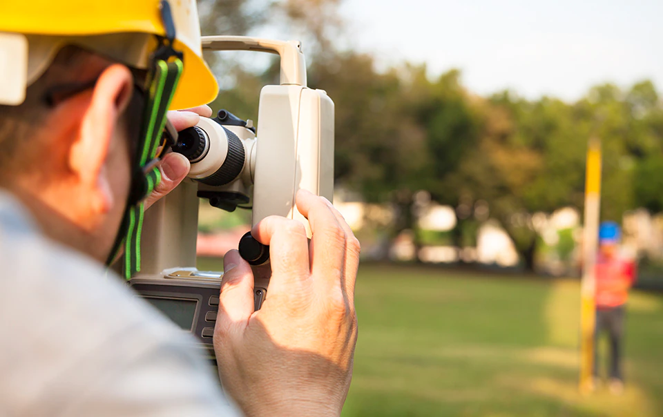 Man surveying new construction site.