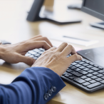 Close up picture of businessman using keyboard