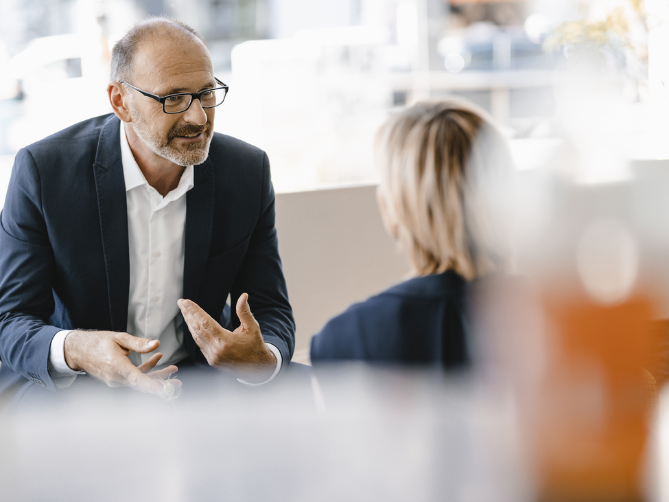 Business people having a meeting in a coffee shop.