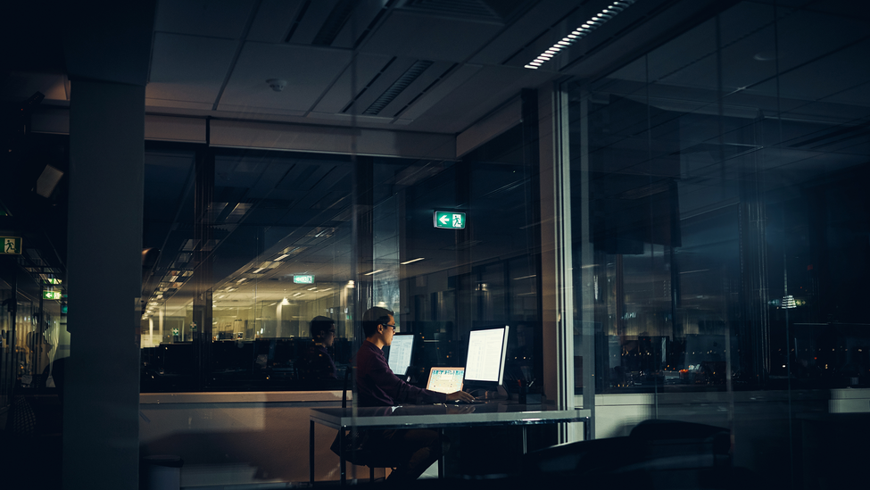 A businessman working late in an office.