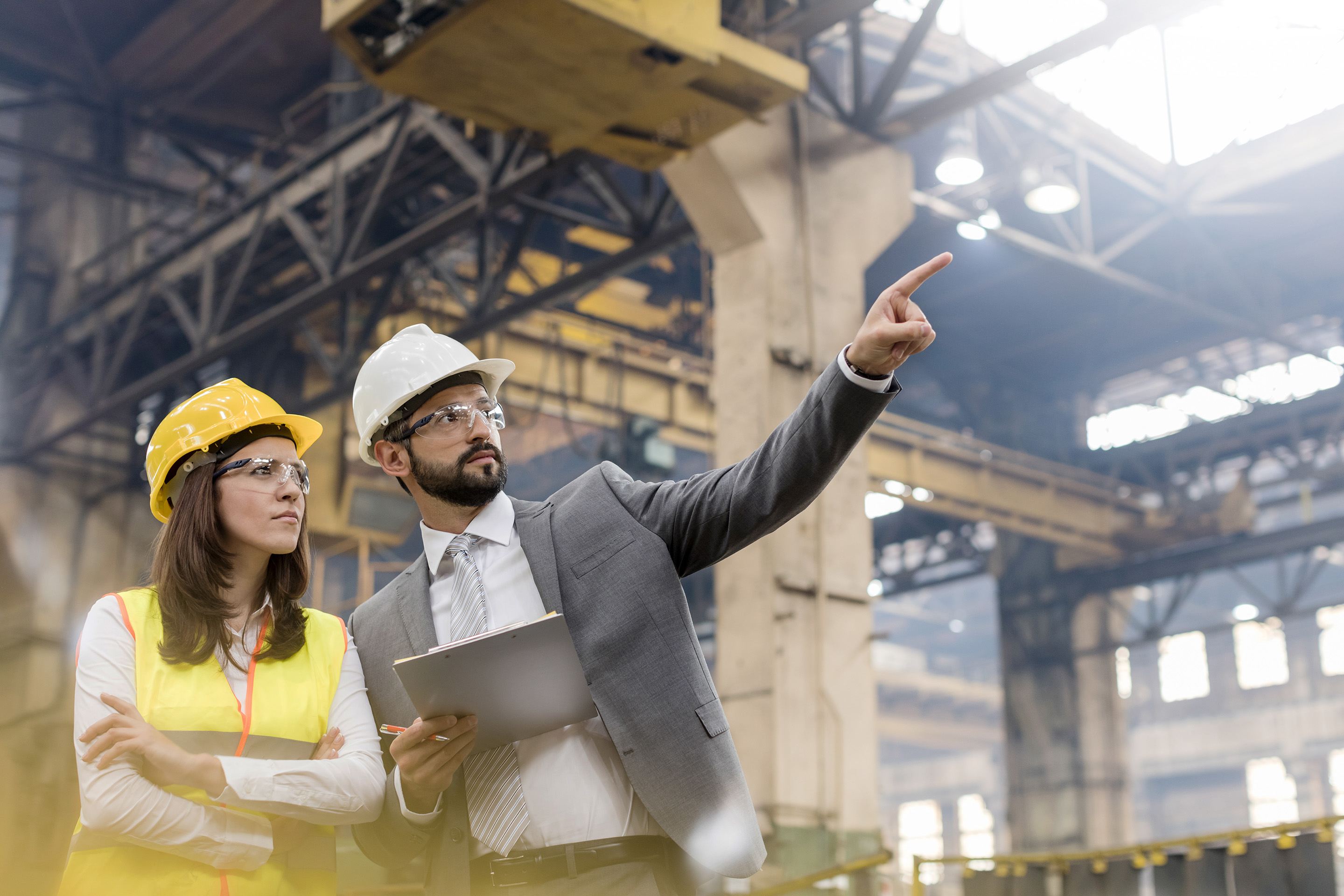 manufacturing employees assessing a factory