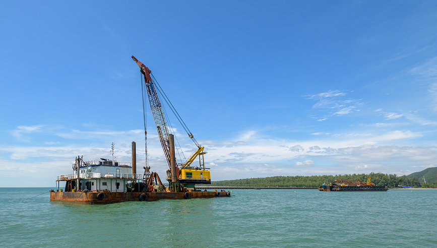 Crane on a barge of a marine construction site