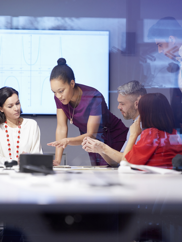 A group of people meeting in a conference room.