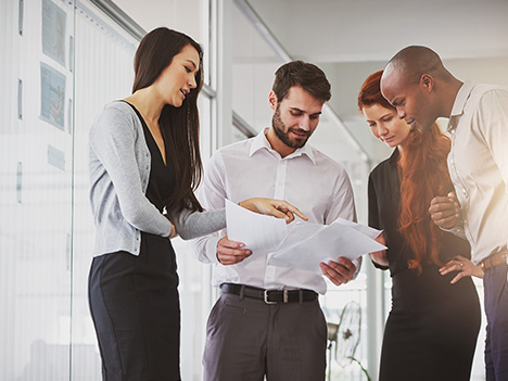 Employees analyzing business documents.