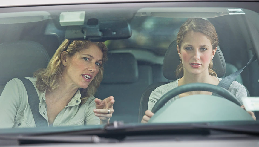 Mom driving with teen in insured car.