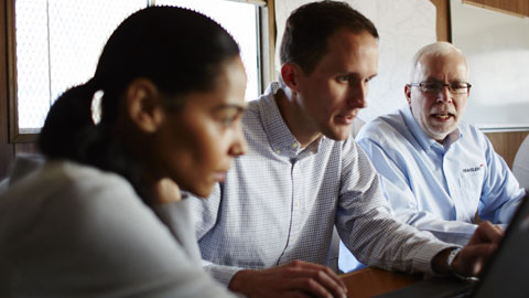 People meeting around a conference table.