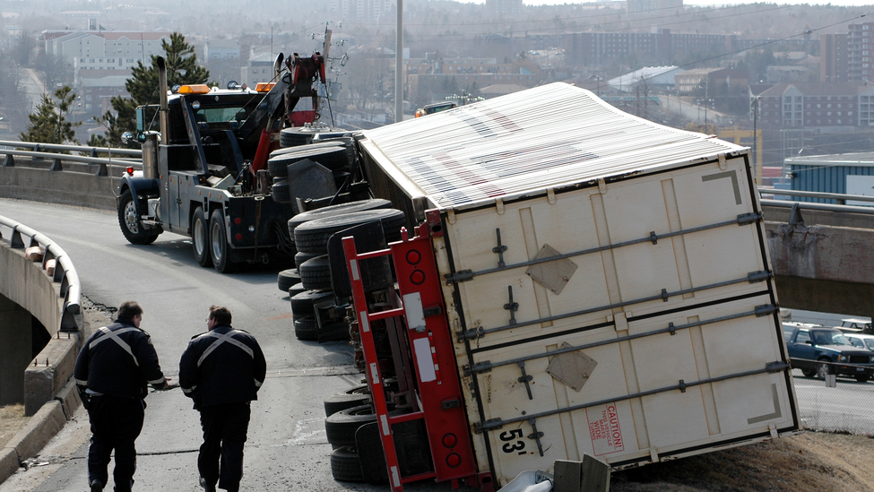 Tow truck with overturned truck