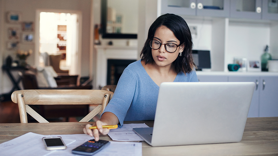 Person researching how to save on car insurance.