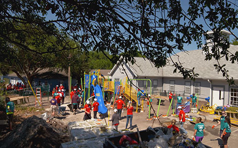 Travelers employees at the KaBOOM playground.
