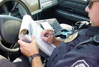 police officer writing ticket