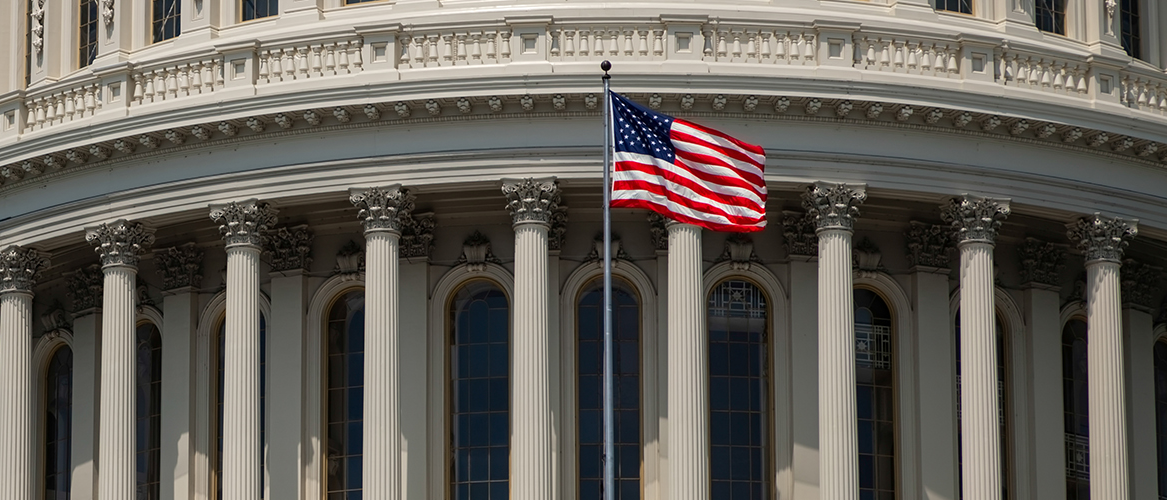 Public building with an American flag flying in front.