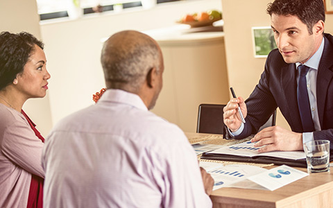 Couple meeting with car insurance agent.