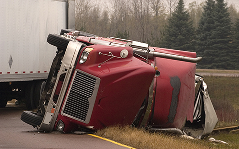 Red overturned truck