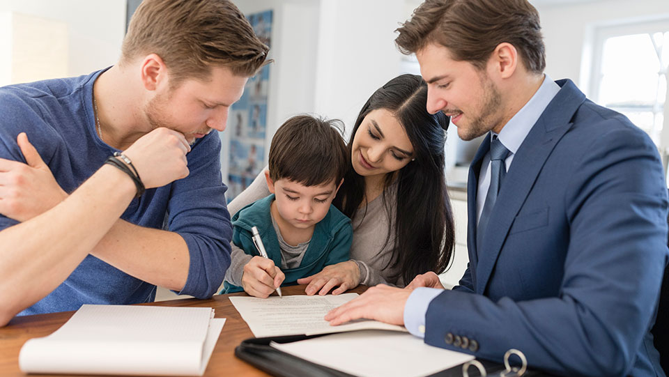 Family meeting with real estate agent buying new home.