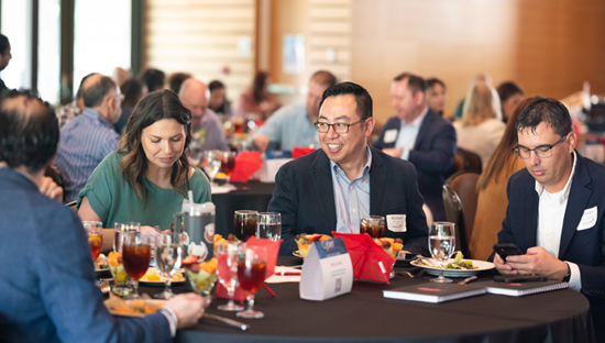 Attendees at San Antonio cyber event seated at table