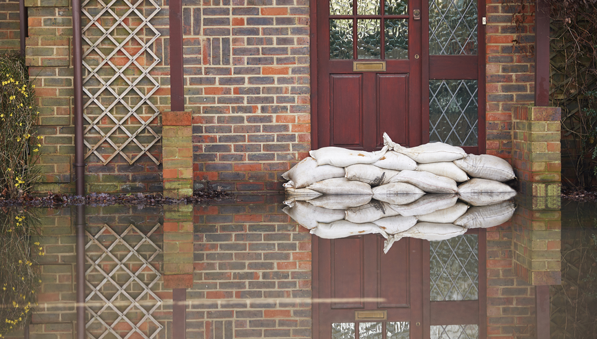 Sandbags near house door during flood