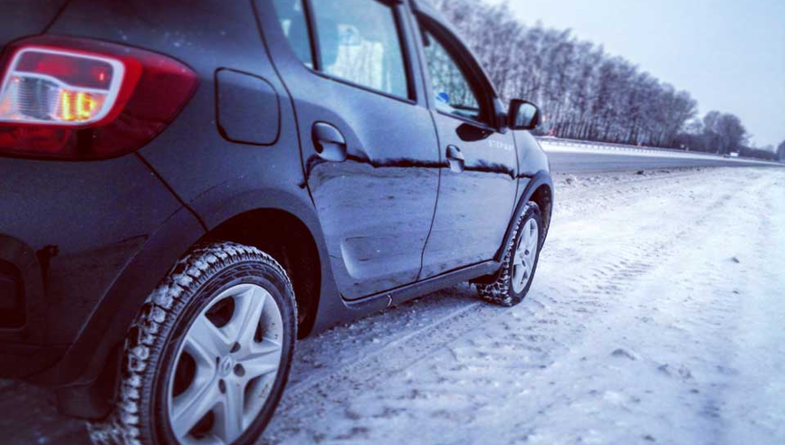 Car driving on wintery road