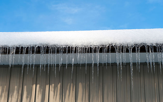 Snow on roof of a commercial building.