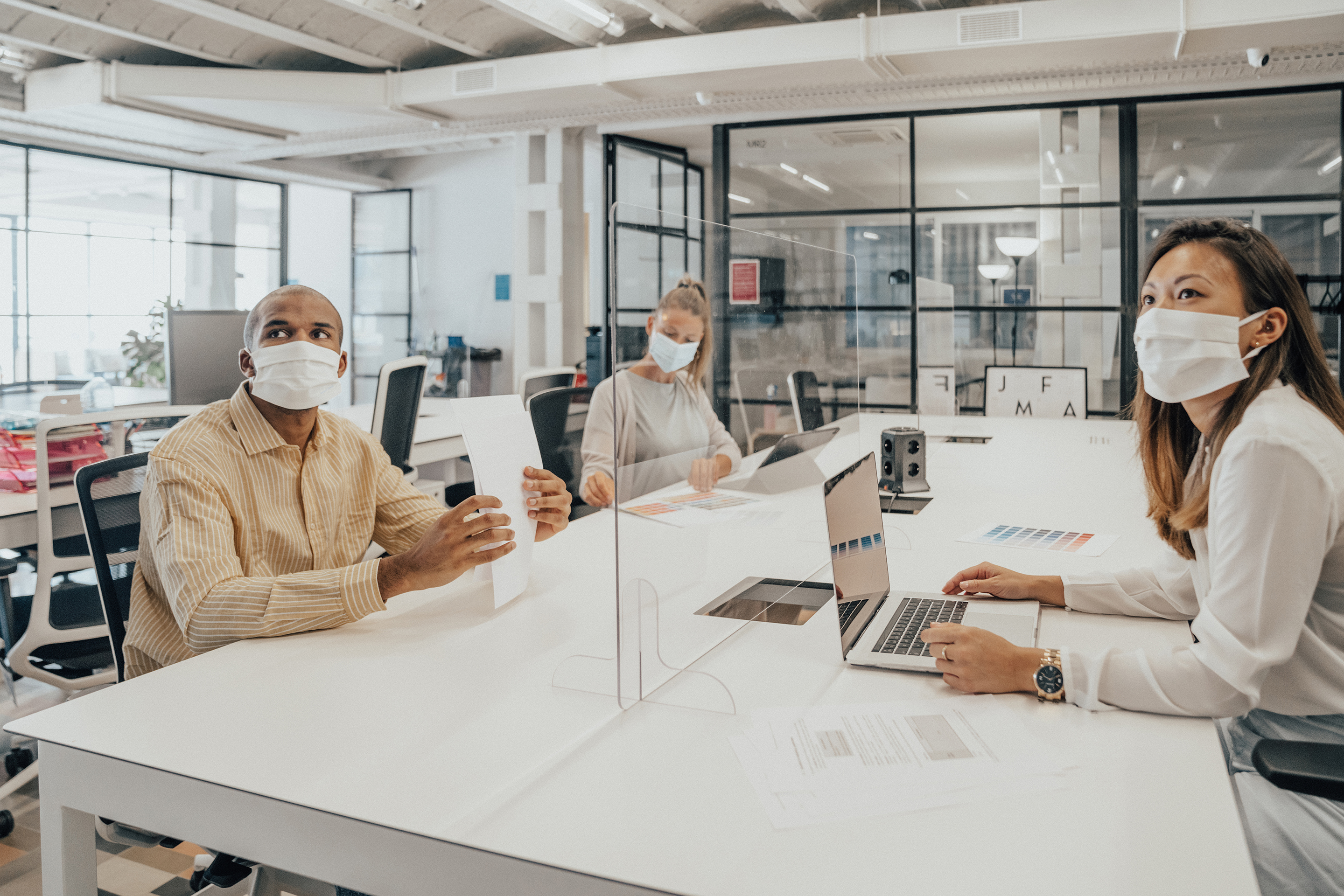 Group of coworkers meeting in a conference room.