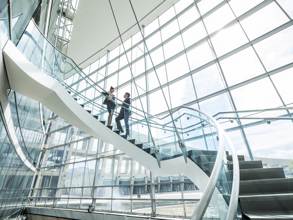 Business people having a conversation on a stairwell.